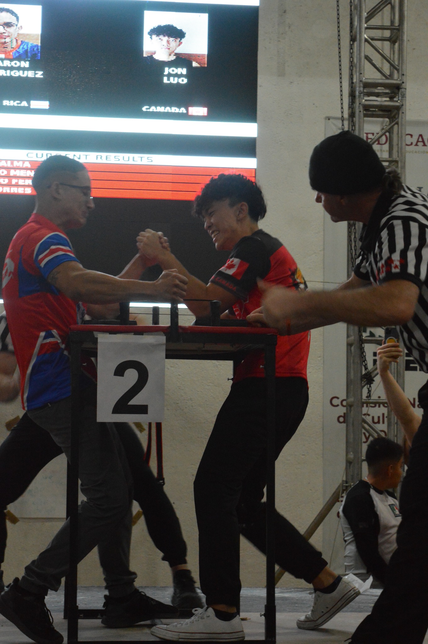 A young Team Canada athlete competing at the armwrestling table
